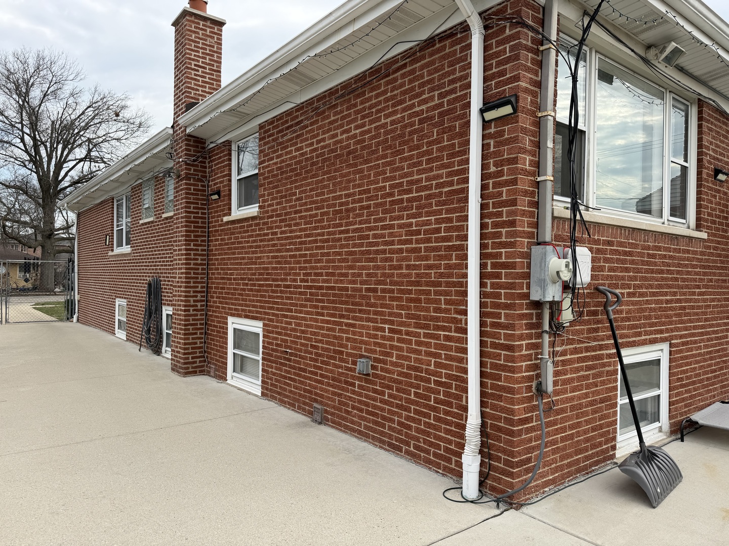 2571 Suffield Street Des Plaines, IL 60016 - Photo 8 of 10 a view of a brick house with many windows