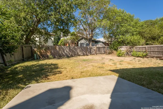 a house view with a backyard space