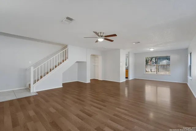 a view of kitchen and hall with wooden floor
