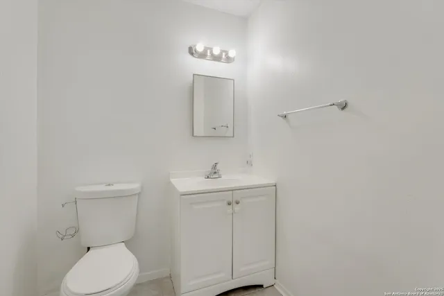 a large kitchen with stainless steel appliances granite countertop a sink and a stove