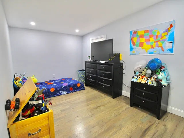 a bedroom with a bed and furniture