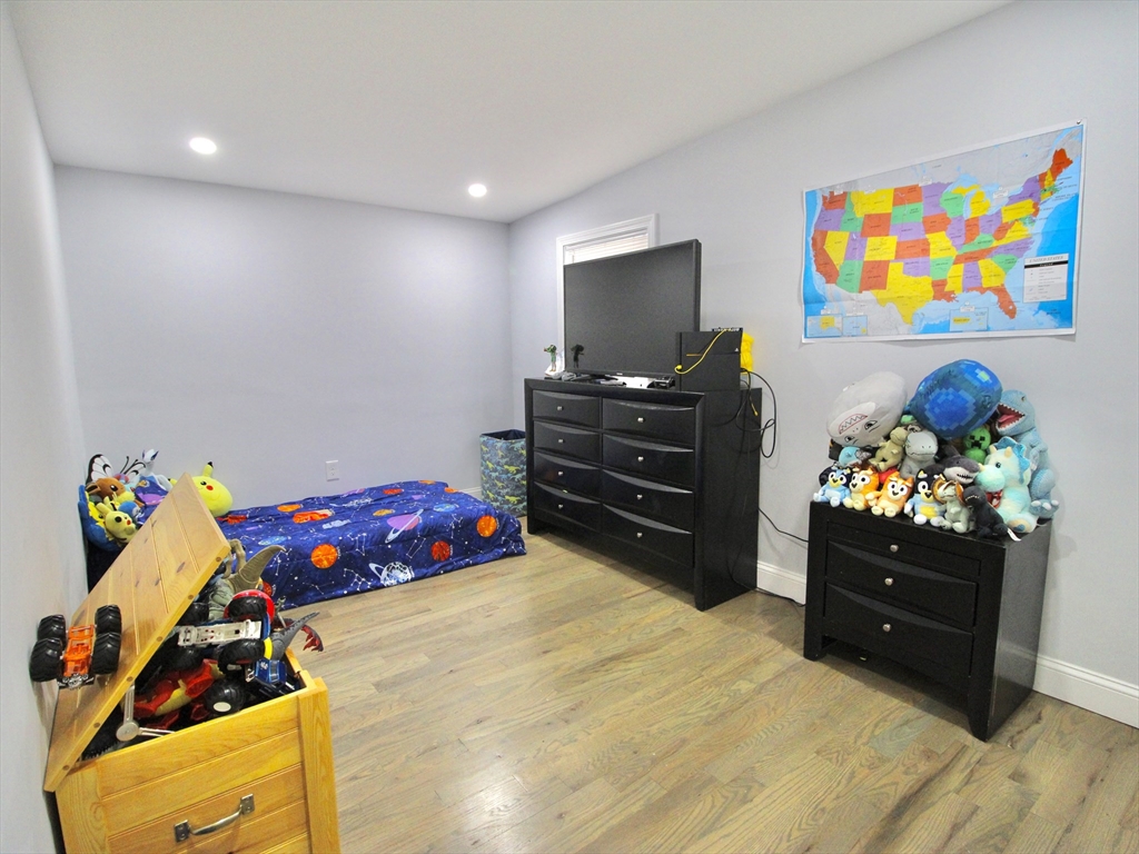 210 Nichols Street Gardner, MA 01440 - Photo 11 of 25 a bedroom with a bed and furniture