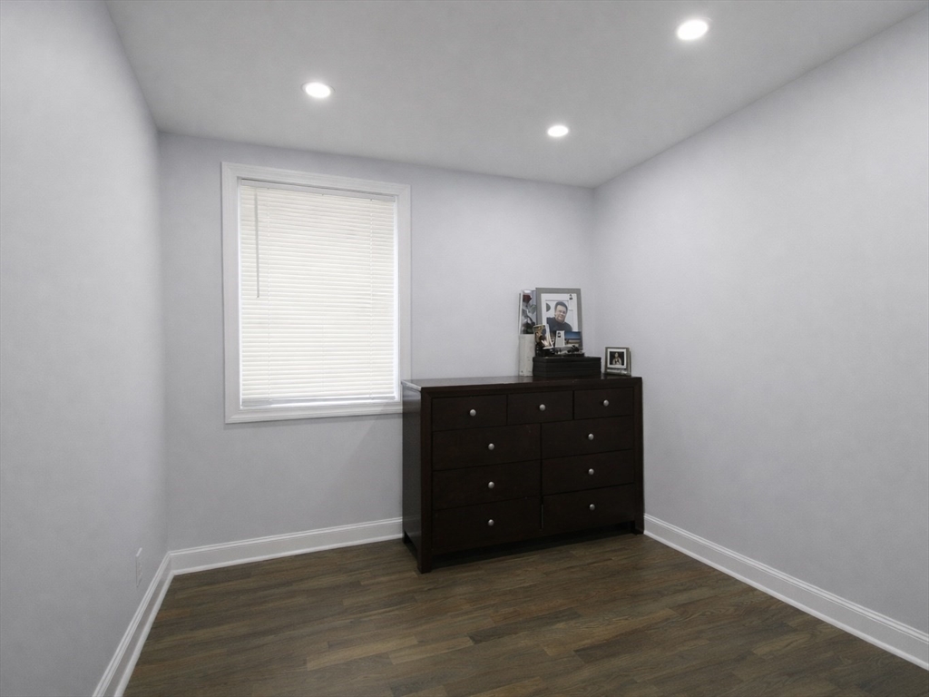 210 Nichols Street Gardner, MA 01440 - Photo 13 of 25 a room with a window and wooden floor