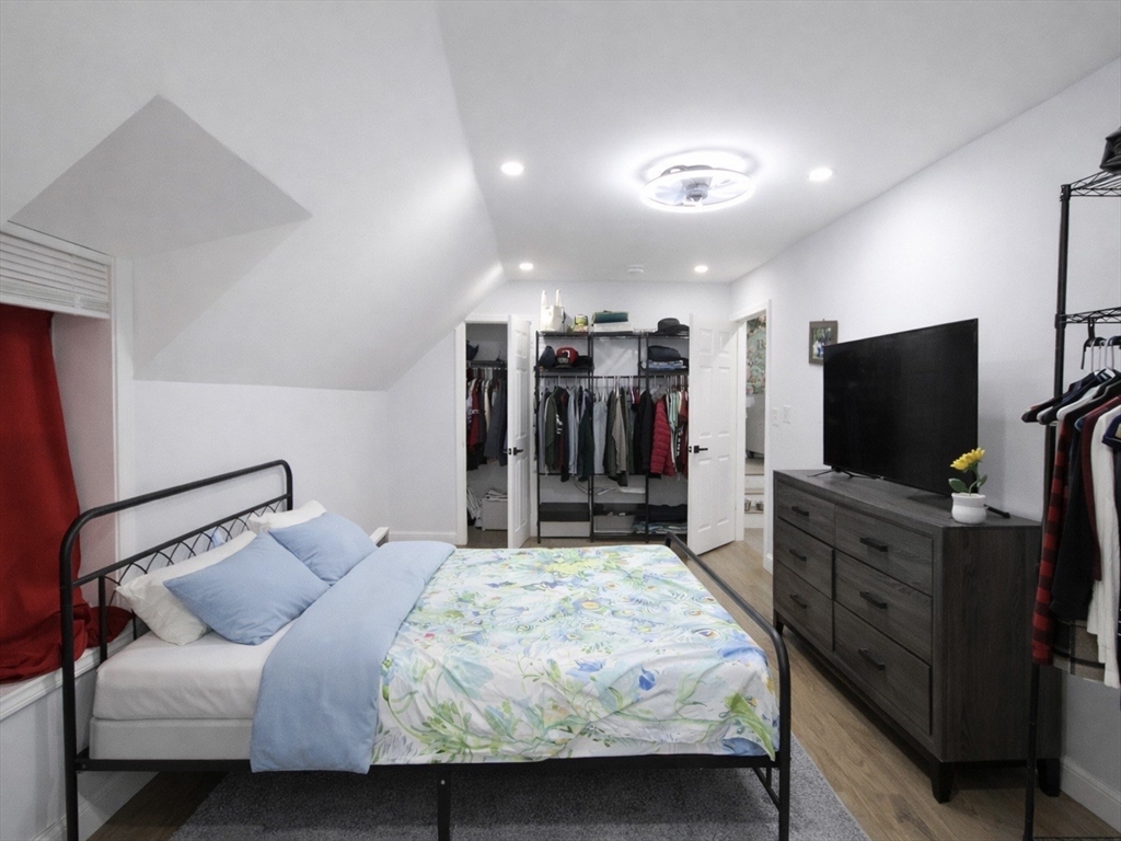210 Nichols Street Gardner, MA 01440 - Photo 19 of 25 a bedroom with a bed and a flat screen tv