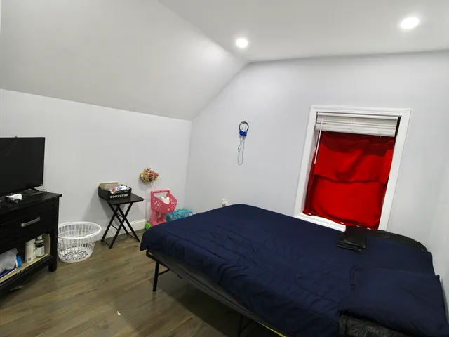 a bathroom with a sink toilet double vanity and shower