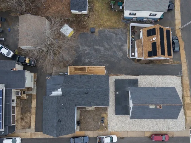 an aerial view of residential houses with outdoor space