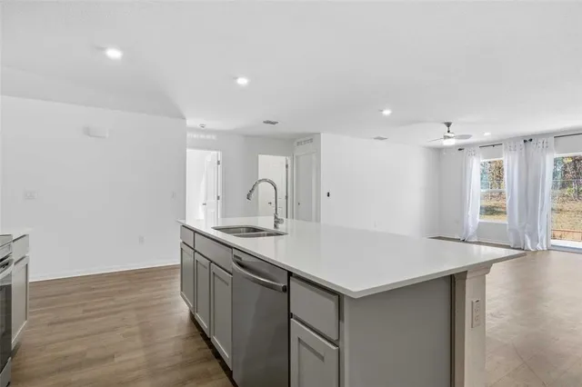 a kitchen with a sink and cabinets