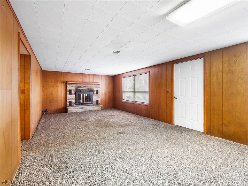 38700 Detroit Road Avon, OH 44011 - Photo 24 of 30 Lower level living room with 2nd wood fireplace and walk out entrance.