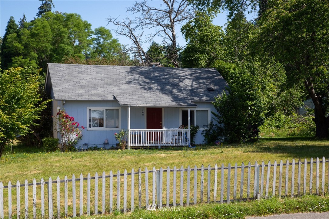 416-500 Sheridan Road Bremerton, WA 98310 - Photo 1 of 13 a front view of a house with a garden