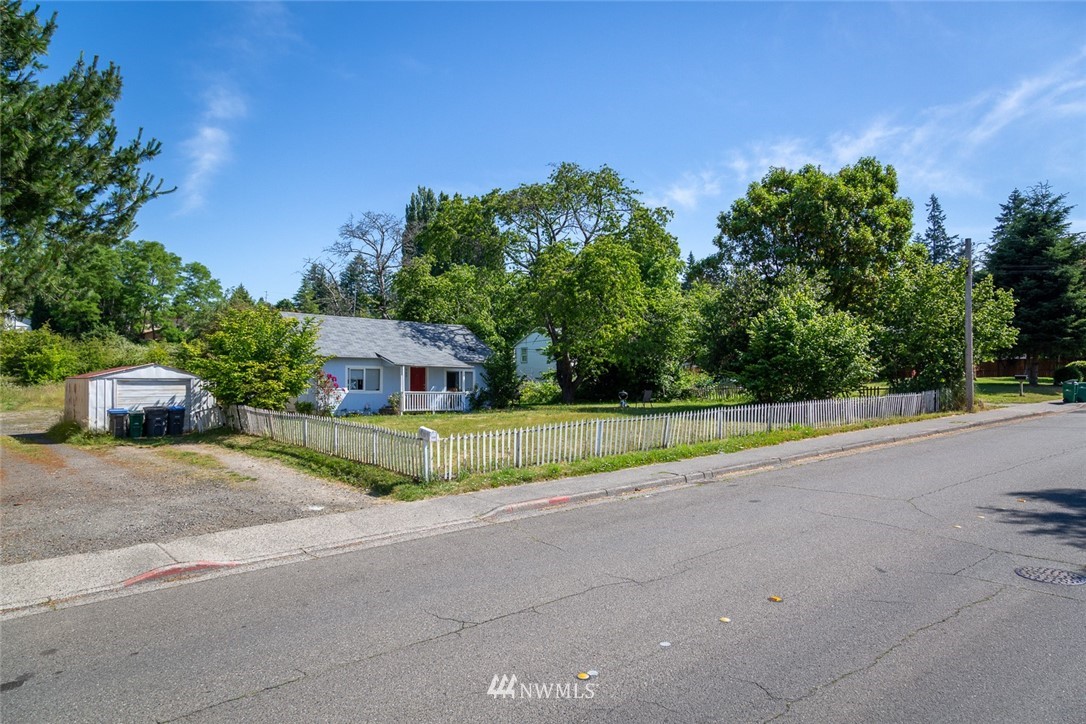 416-500 Sheridan Road Bremerton, WA 98310 - Photo 13 of 13 a view of a house with a yard and large trees