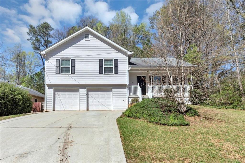 5848 Dunn Road Mableton, GA 30126 - Photo 1 of 1 a front view of a house with a garden
