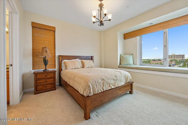 a spacious bedroom with a bed and window