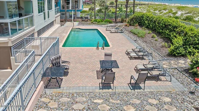 a view of balcony with furniture and garden