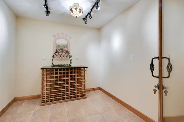 a living room with furniture a lamp and a large window