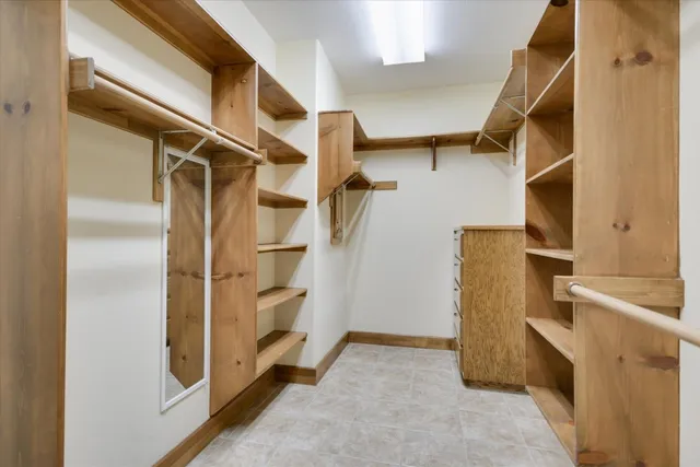 a view of a bathroom with a bathtub and shower