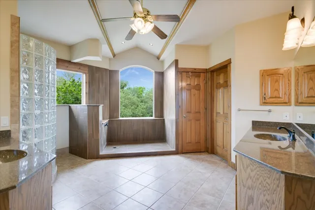 a bathroom with a double vanity sink mirror and double