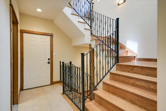 a view of a balcony with furniture and floor to ceiling window