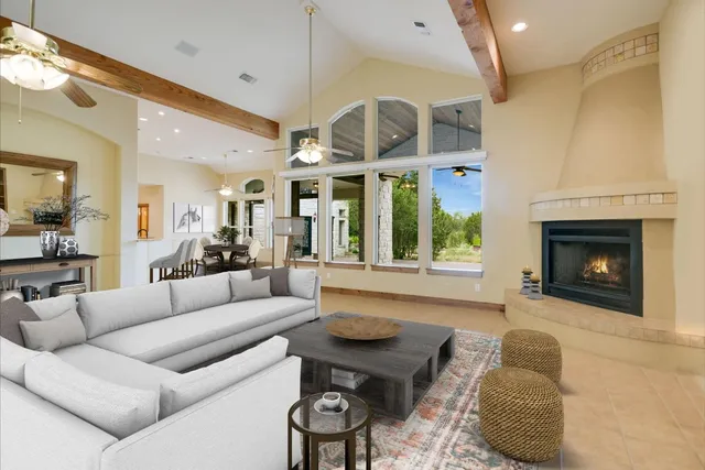 a view of a dining room with furniture and chandelier