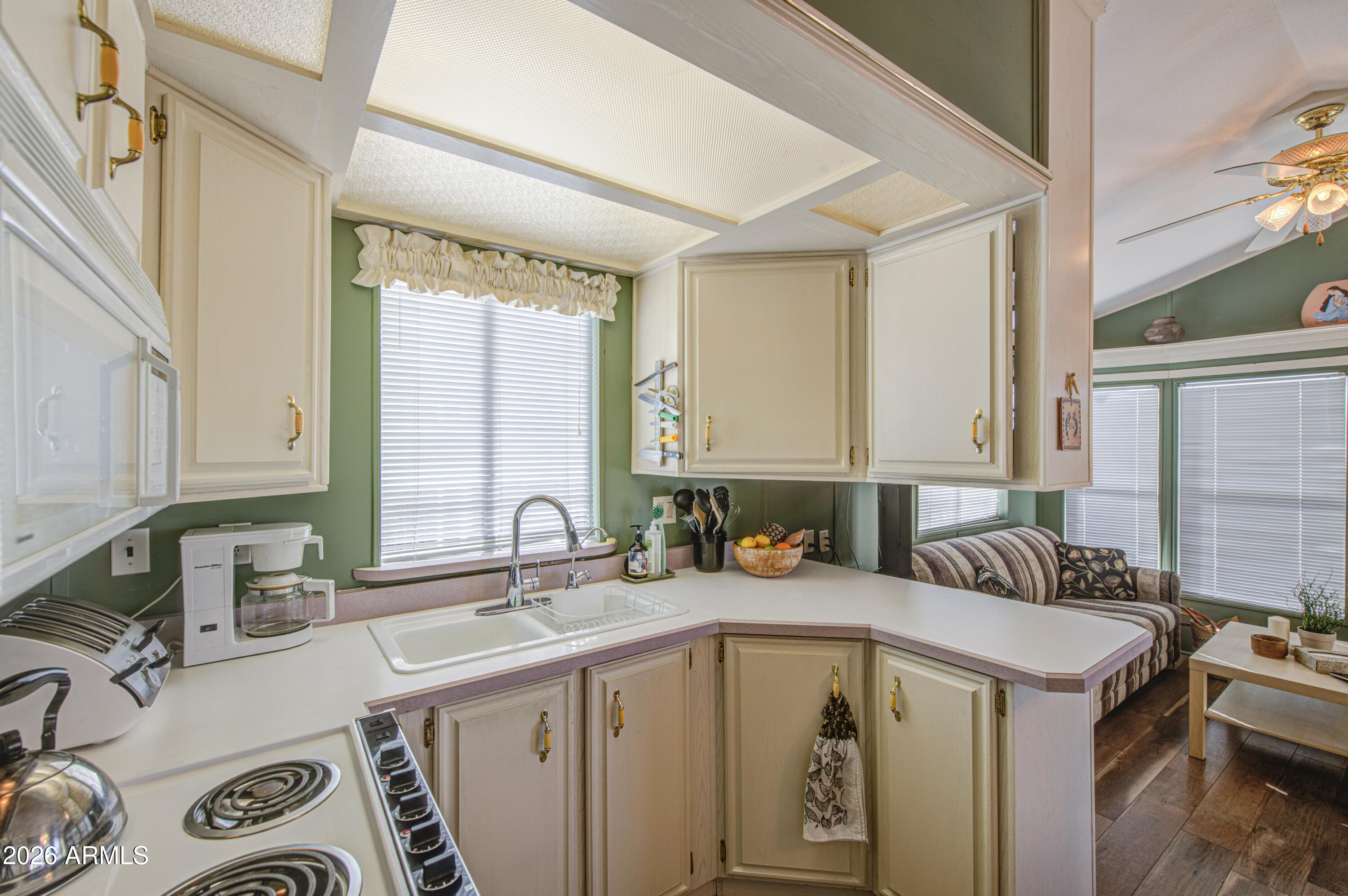 111 South Greenfield Road, Unit 408 Mesa, AZ 85206 - Photo 12 of 22 a bathroom with a sink a mirror and a bathtub