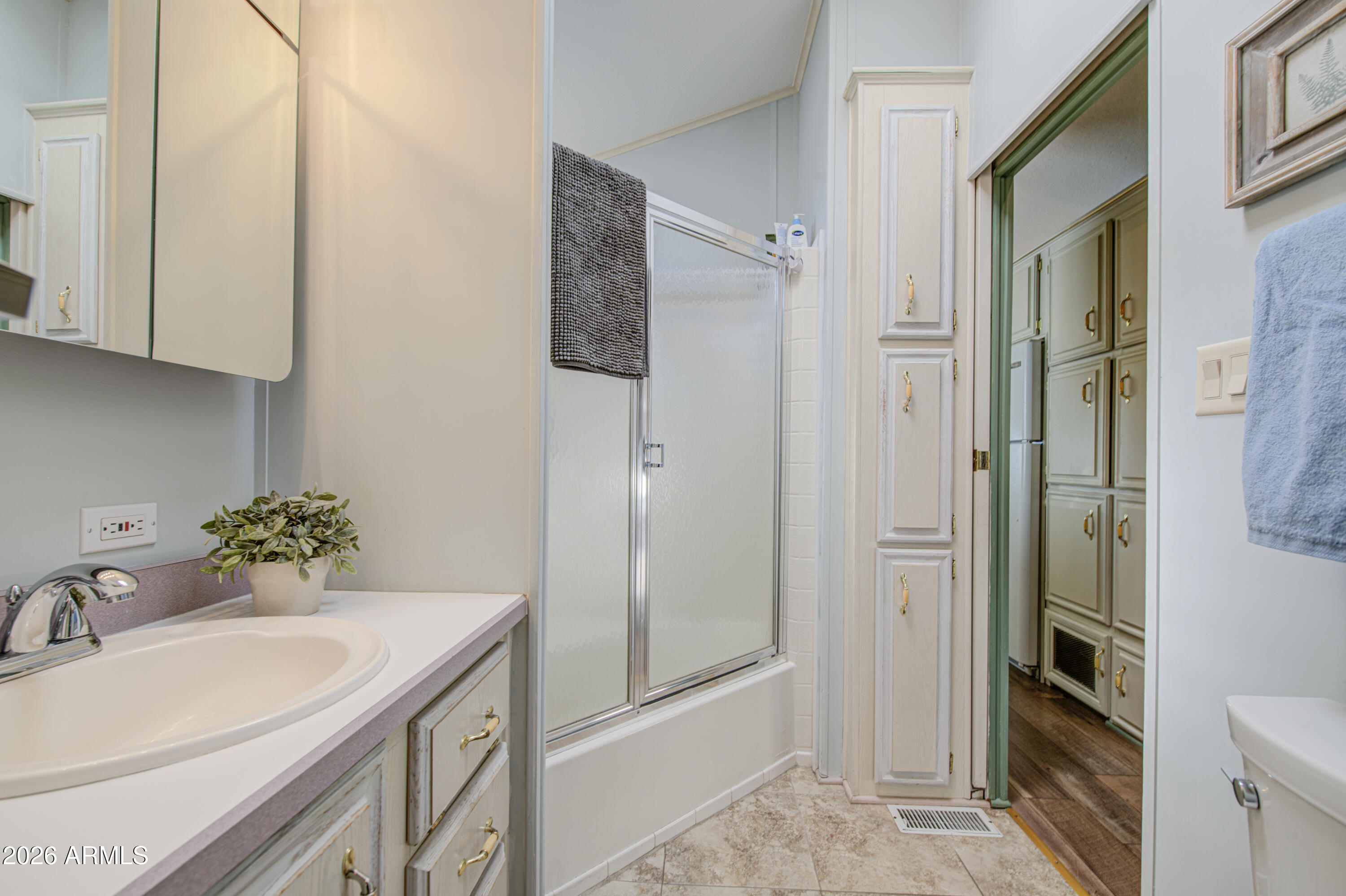 111 South Greenfield Road, Unit 408 Mesa, AZ 85206 - Photo 15 of 22 a bathroom with a sink toilet and shower
