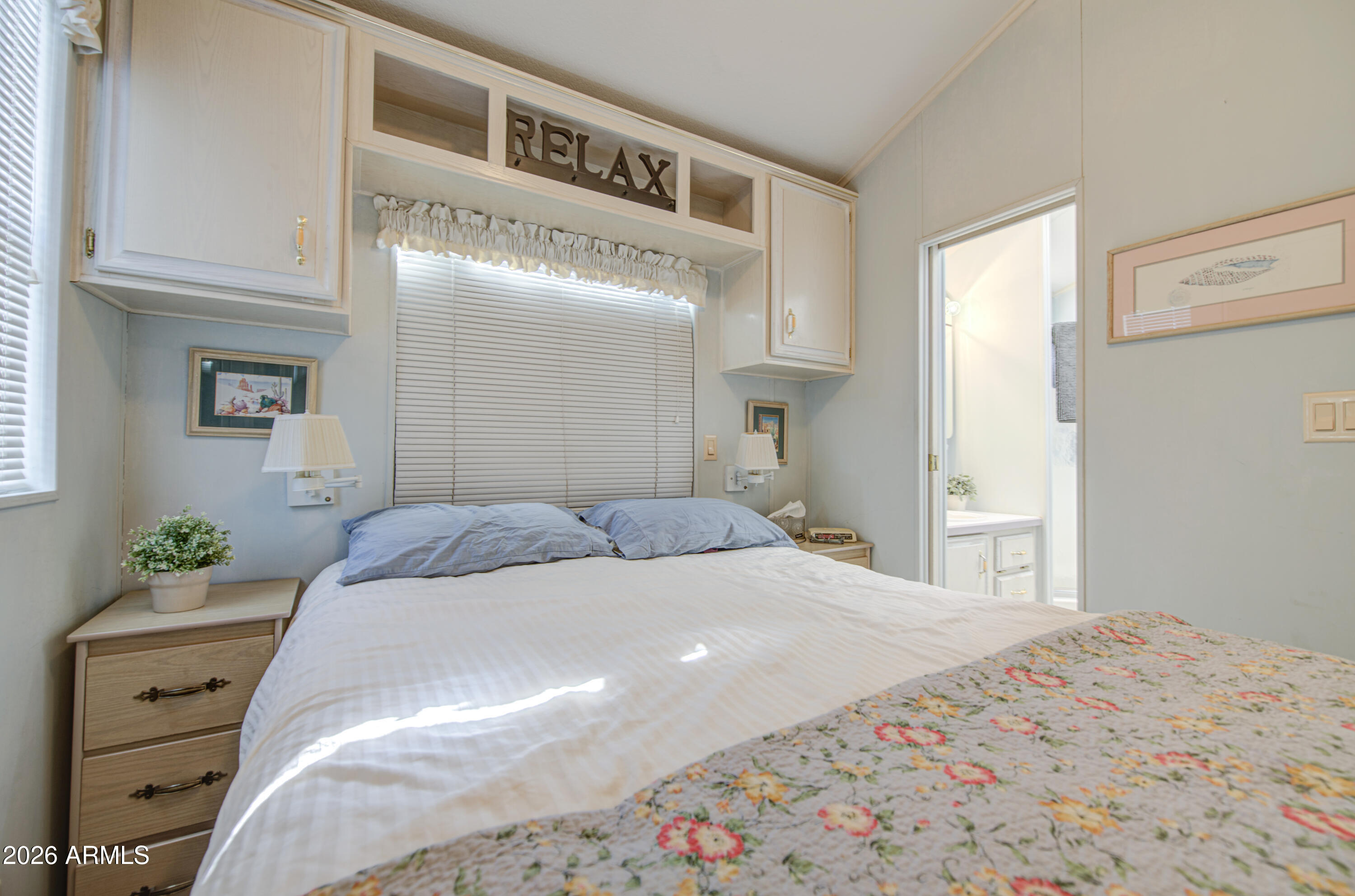 111 South Greenfield Road, Unit 408 Mesa, AZ 85206 - Photo 18 of 22 a bedroom with a bed and closet