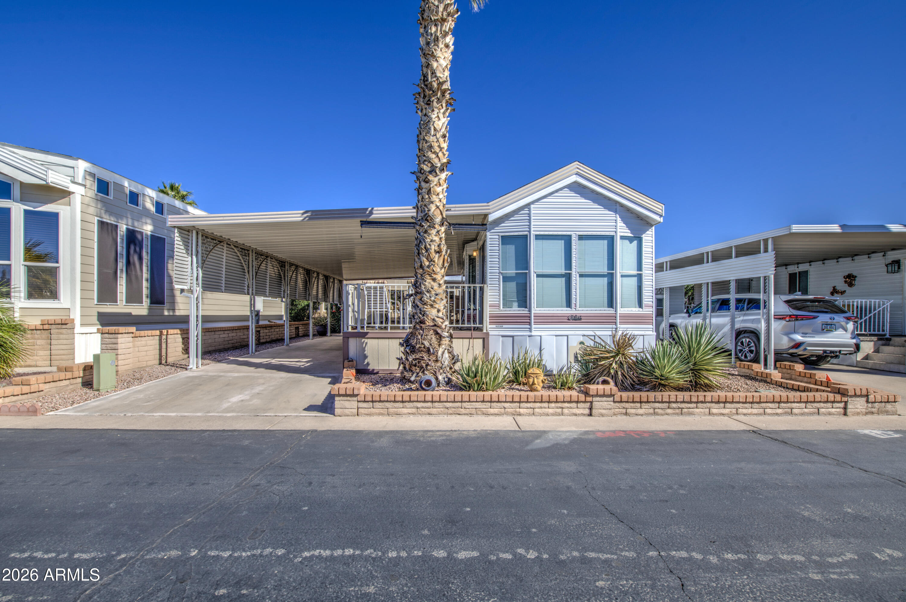 111 South Greenfield Road, Unit 408 Mesa, AZ 85206 - Photo 4 of 22 a front view of a building with street