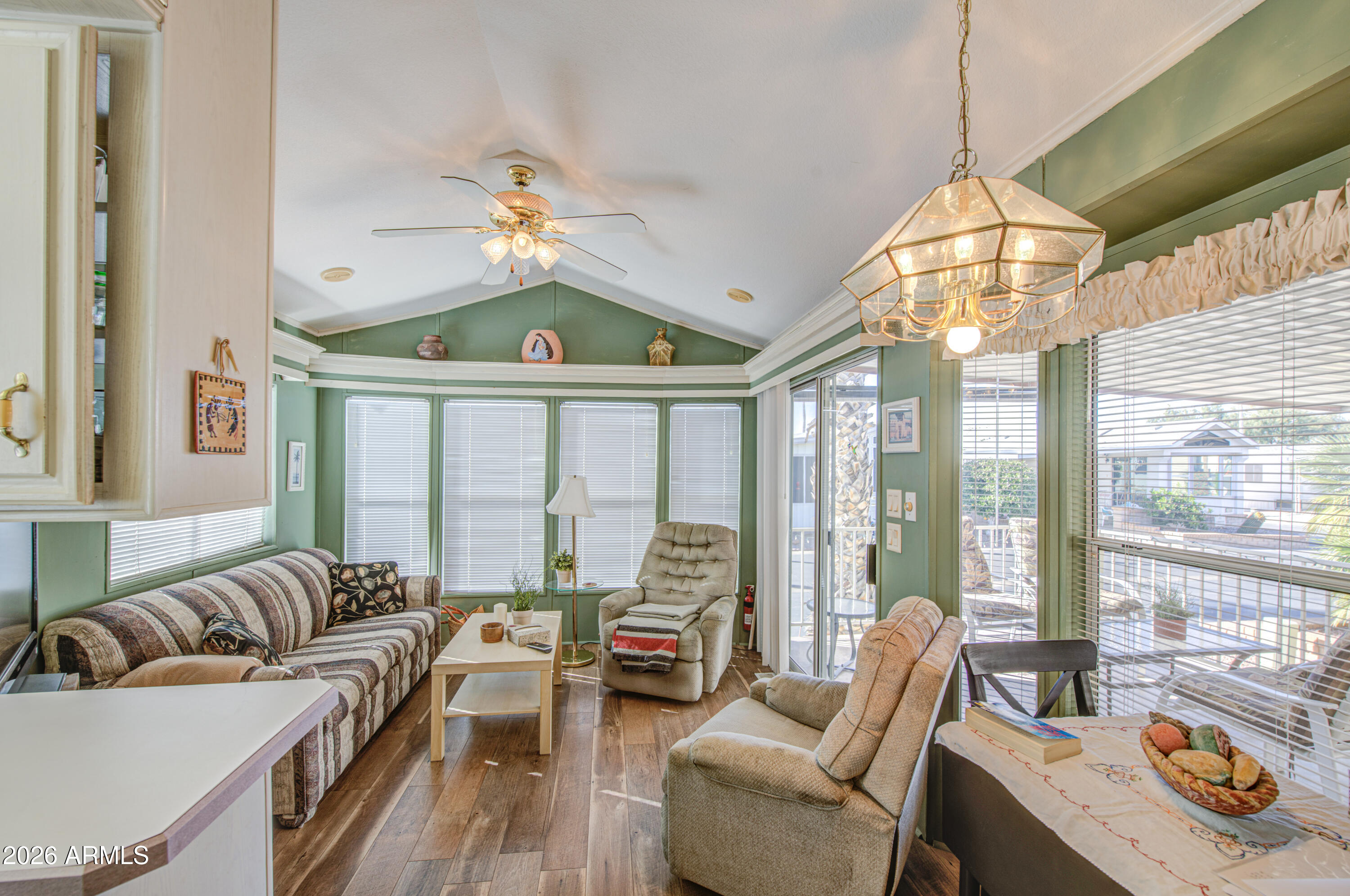 111 South Greenfield Road, Unit 408 Mesa, AZ 85206 - Photo 7 of 22 a living room with furniture and a large window