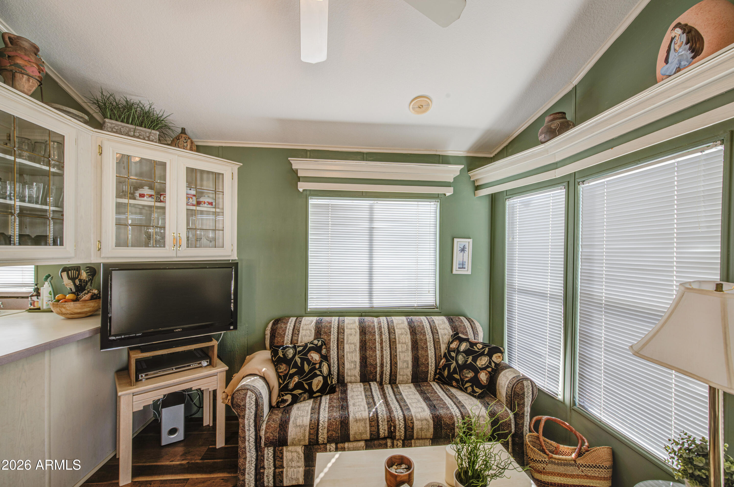 111 South Greenfield Road, Unit 408 Mesa, AZ 85206 - Photo 8 of 22 a bedroom with furniture and flat screen tv