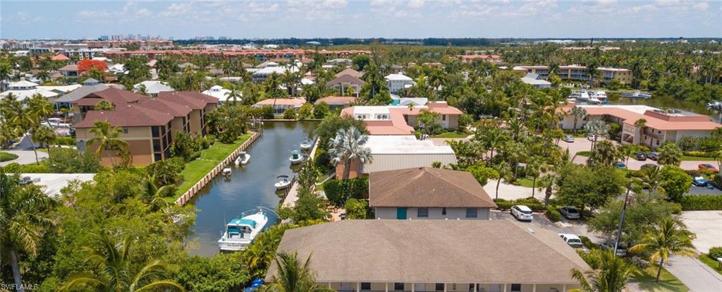 1555 Blue Point Avenue, Unit 3 Naples, FL 34102 - Photo 9 of 9 Birds eye view of property featuring a water view