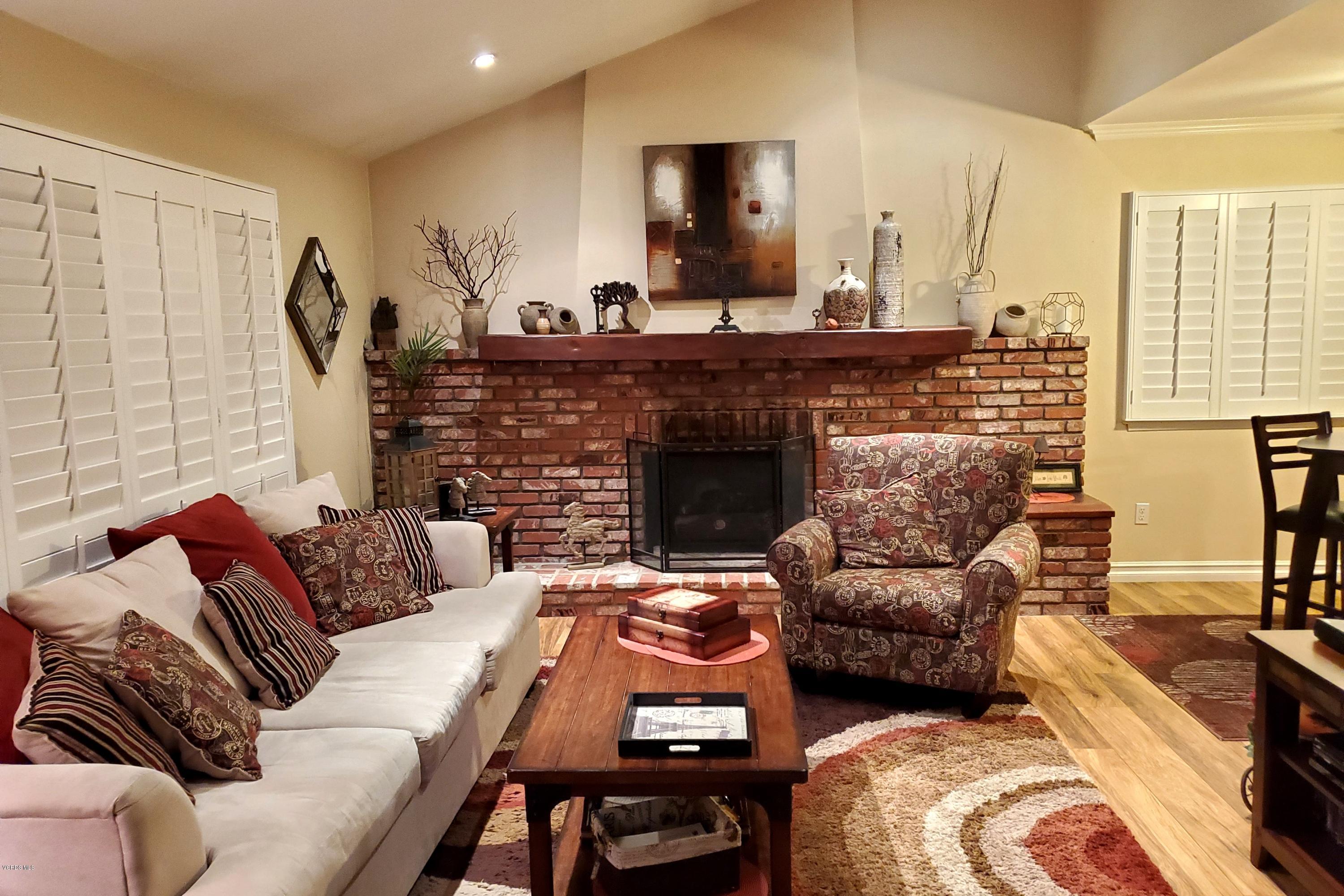 1817 Belhaven Avenue Simi Valley, CA 93063 - Photo 2 of 39 a living room with furniture and a fireplace