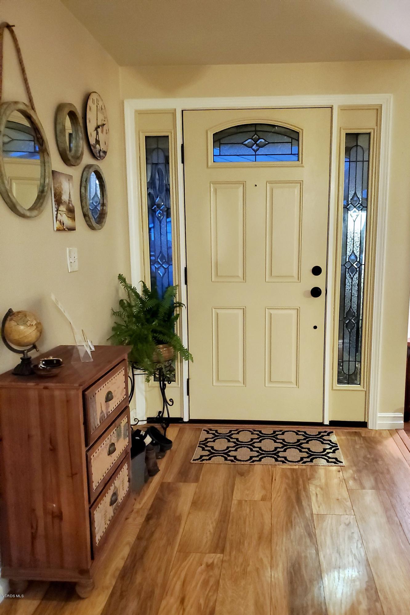 1817 Belhaven Avenue Simi Valley, CA 93063 - Photo 12 of 39 a view of a livingroom with wooden floor and a fireplace