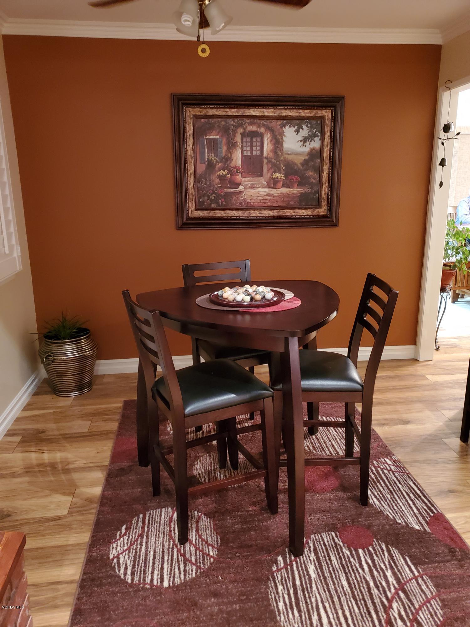 1817 Belhaven Avenue Simi Valley, CA 93063 - Photo 14 of 39 a view of a dining room with furniture and wooden floor
