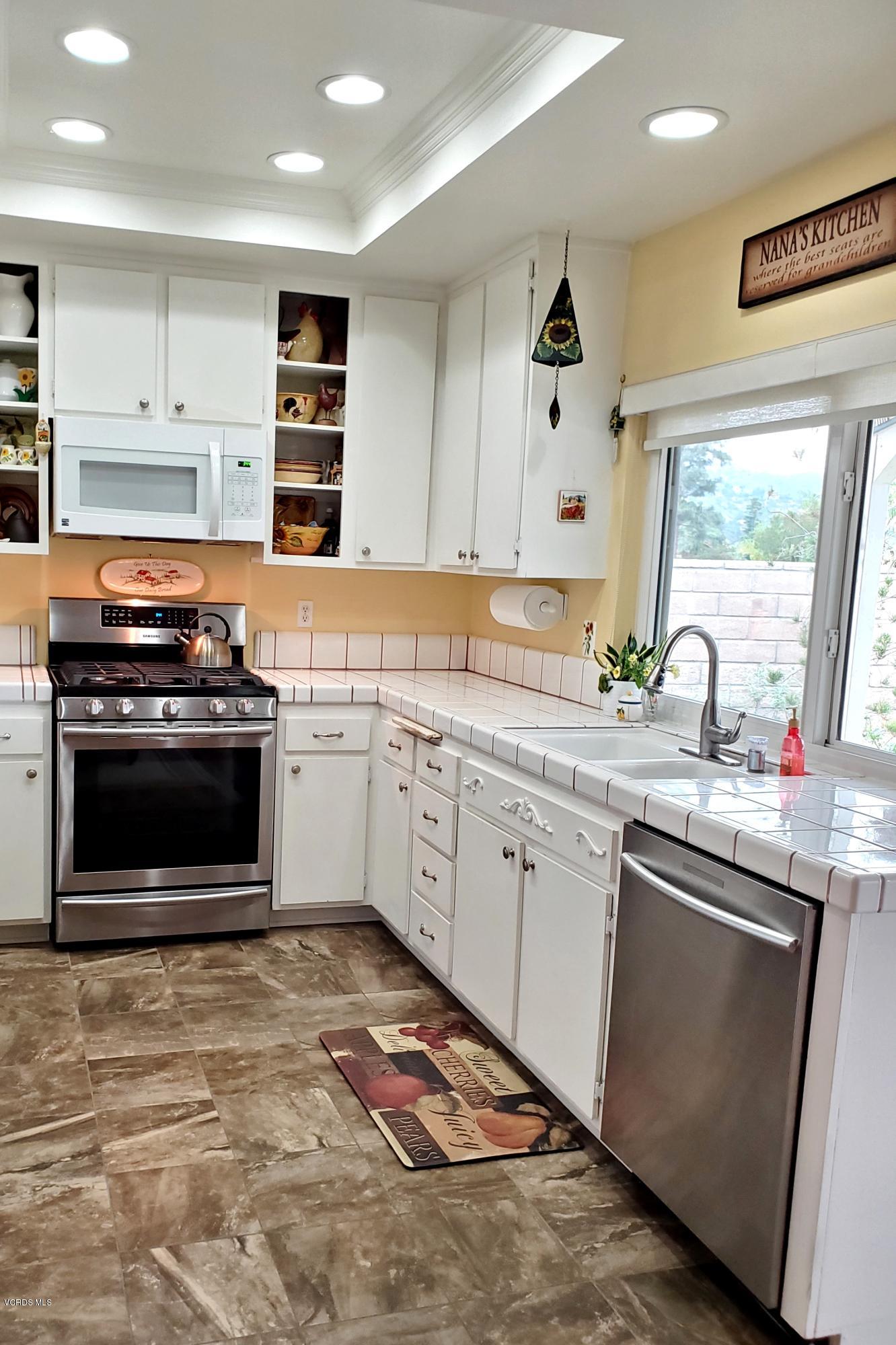 1817 Belhaven Avenue Simi Valley, CA 93063 - Photo 16 of 39 a kitchen with a stove and a sink