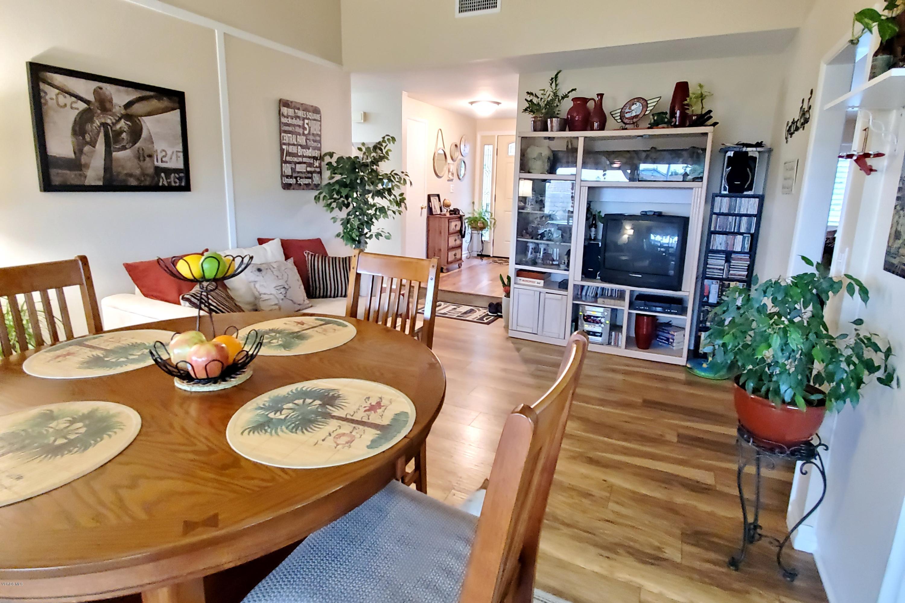1817 Belhaven Avenue Simi Valley, CA 93063 - Photo 19 of 39 a living room with furniture a flat screen tv and a fireplace
