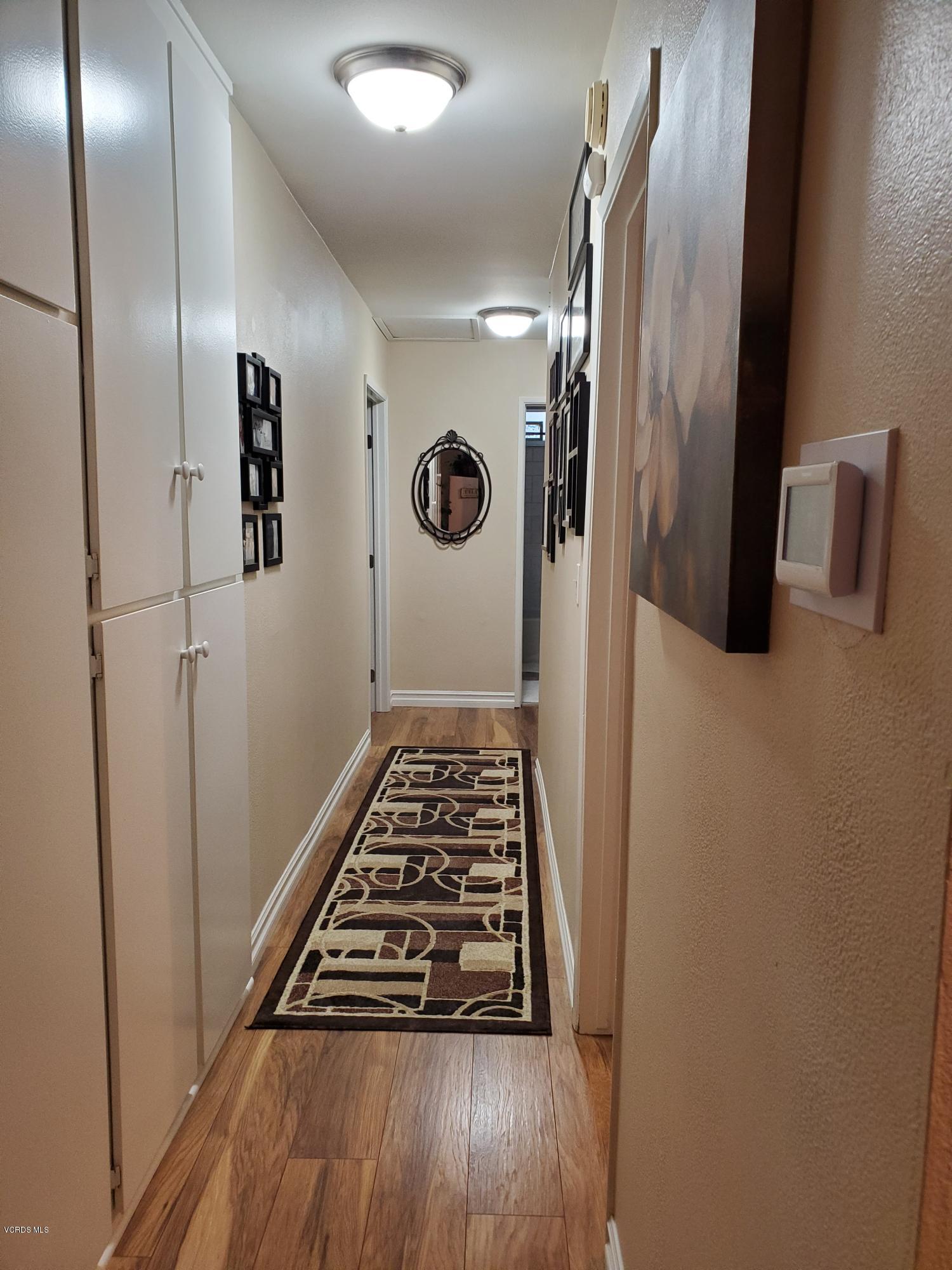 1817 Belhaven Avenue Simi Valley, CA 93063 - Photo 20 of 39 a view of a hallway with wooden floor and staircase