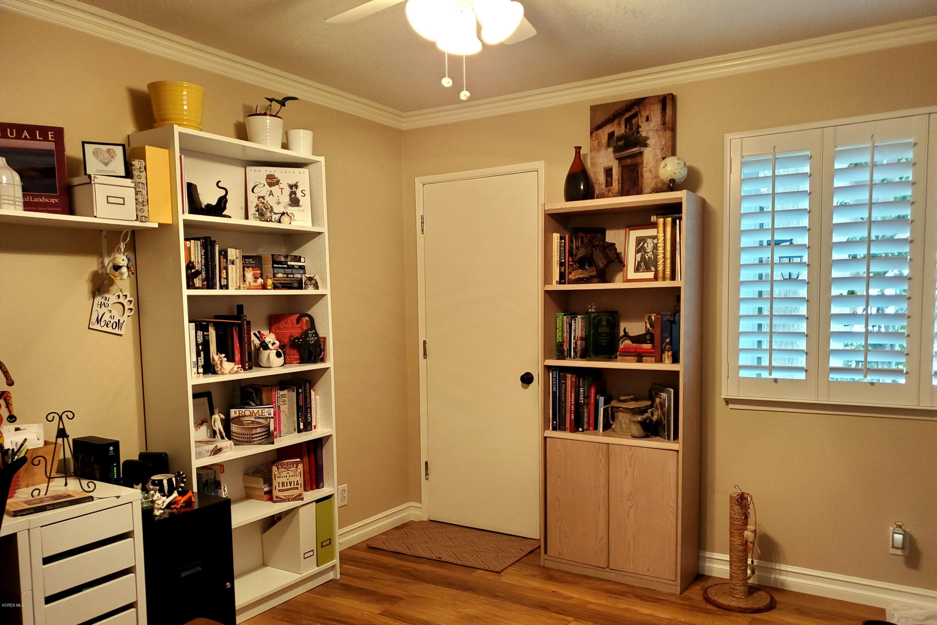 1817 Belhaven Avenue Simi Valley, CA 93063 - Photo 21 of 39 a view of a workspace with bookshelf and a window