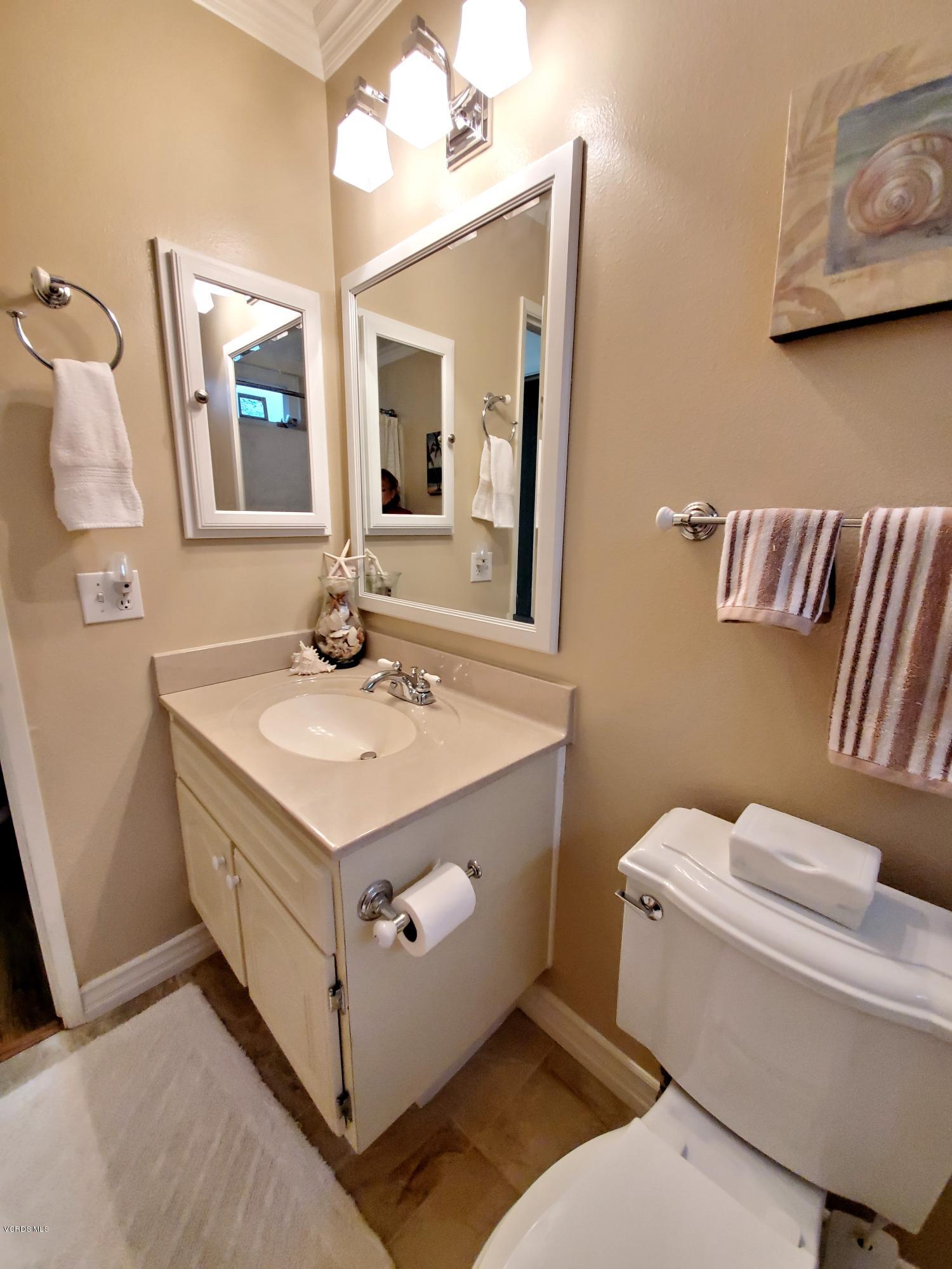 1817 Belhaven Avenue Simi Valley, CA 93063 - Photo 22 of 39 a bathroom with a sink and a mirror