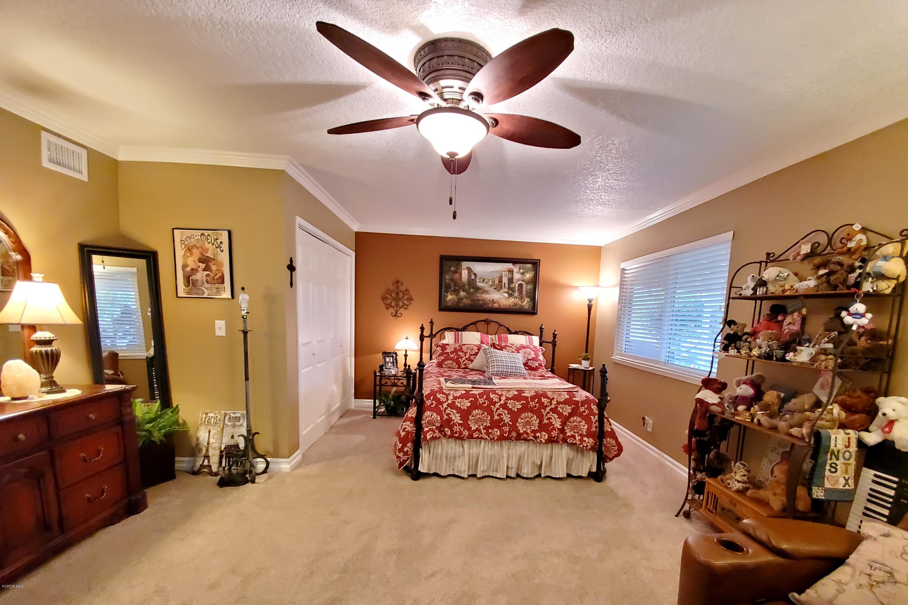 1817 Belhaven Avenue Simi Valley, CA 93063 - Photo 28 of 39 a bedroom with bed and a chandelier