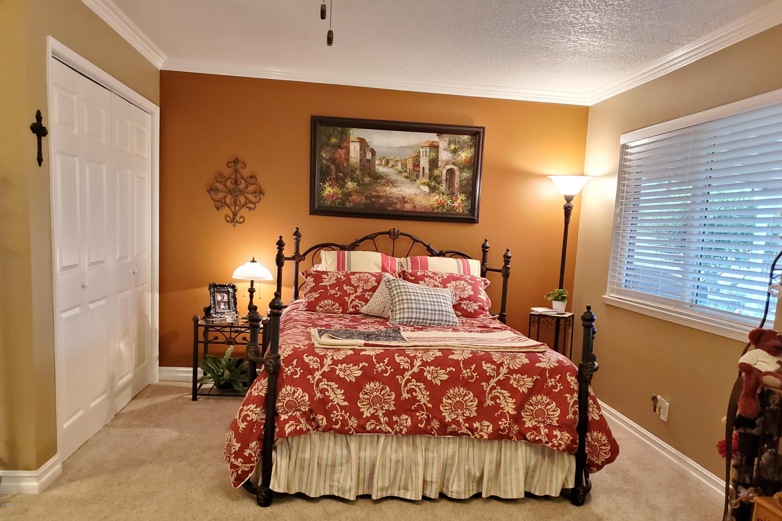 1817 Belhaven Avenue Simi Valley, CA 93063 - Photo 29 of 39 a bedroom with a bed and a painting on the wall