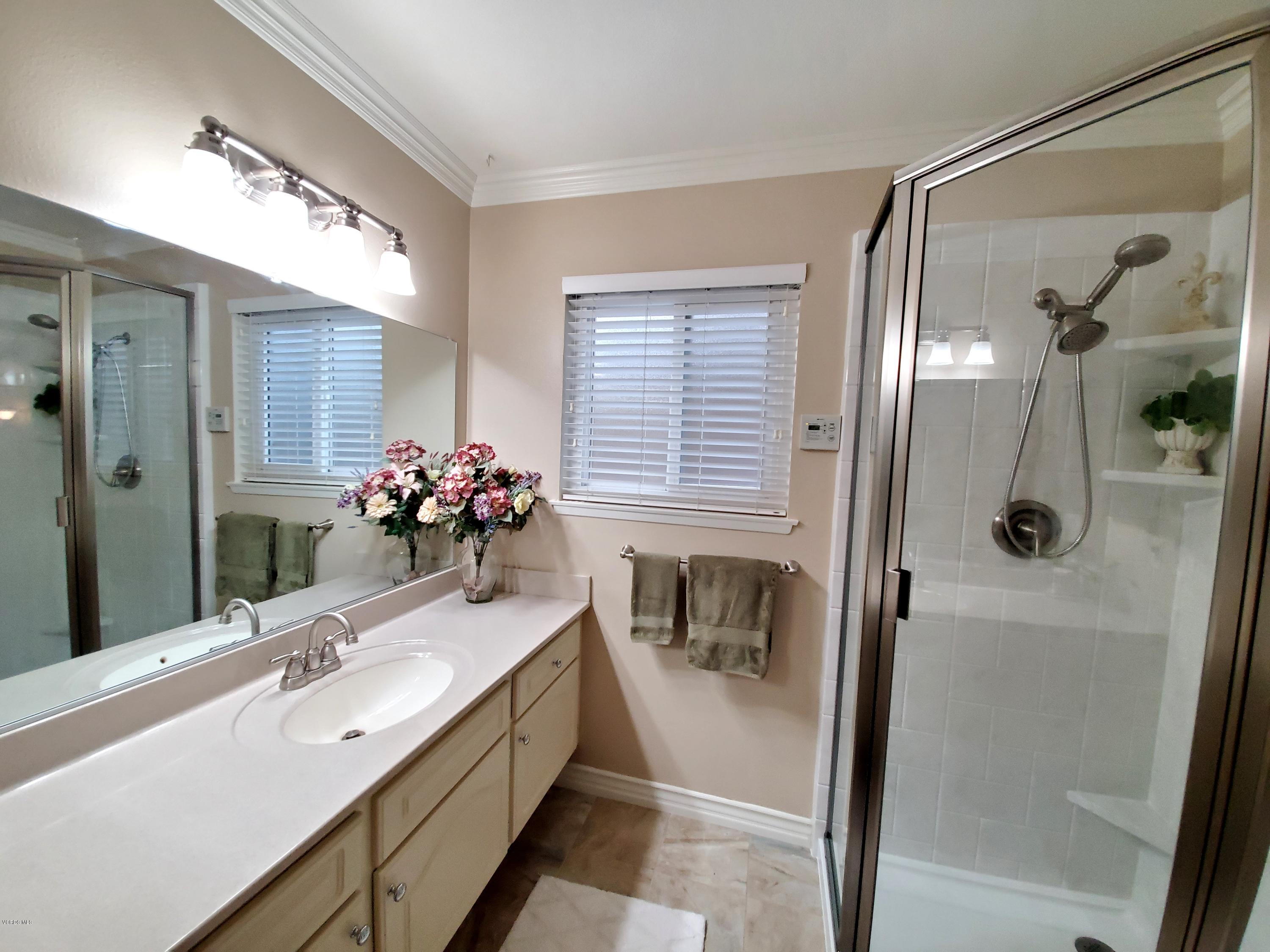 1817 Belhaven Avenue Simi Valley, CA 93063 - Photo 32 of 39 a bathroom with a tub sink and mirror