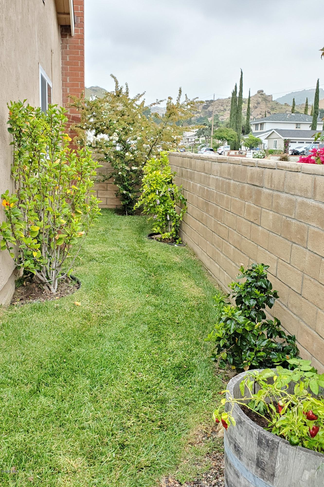 1817 Belhaven Avenue Simi Valley, CA 93063 - Photo 34 of 39 a view of a garden with a fountain