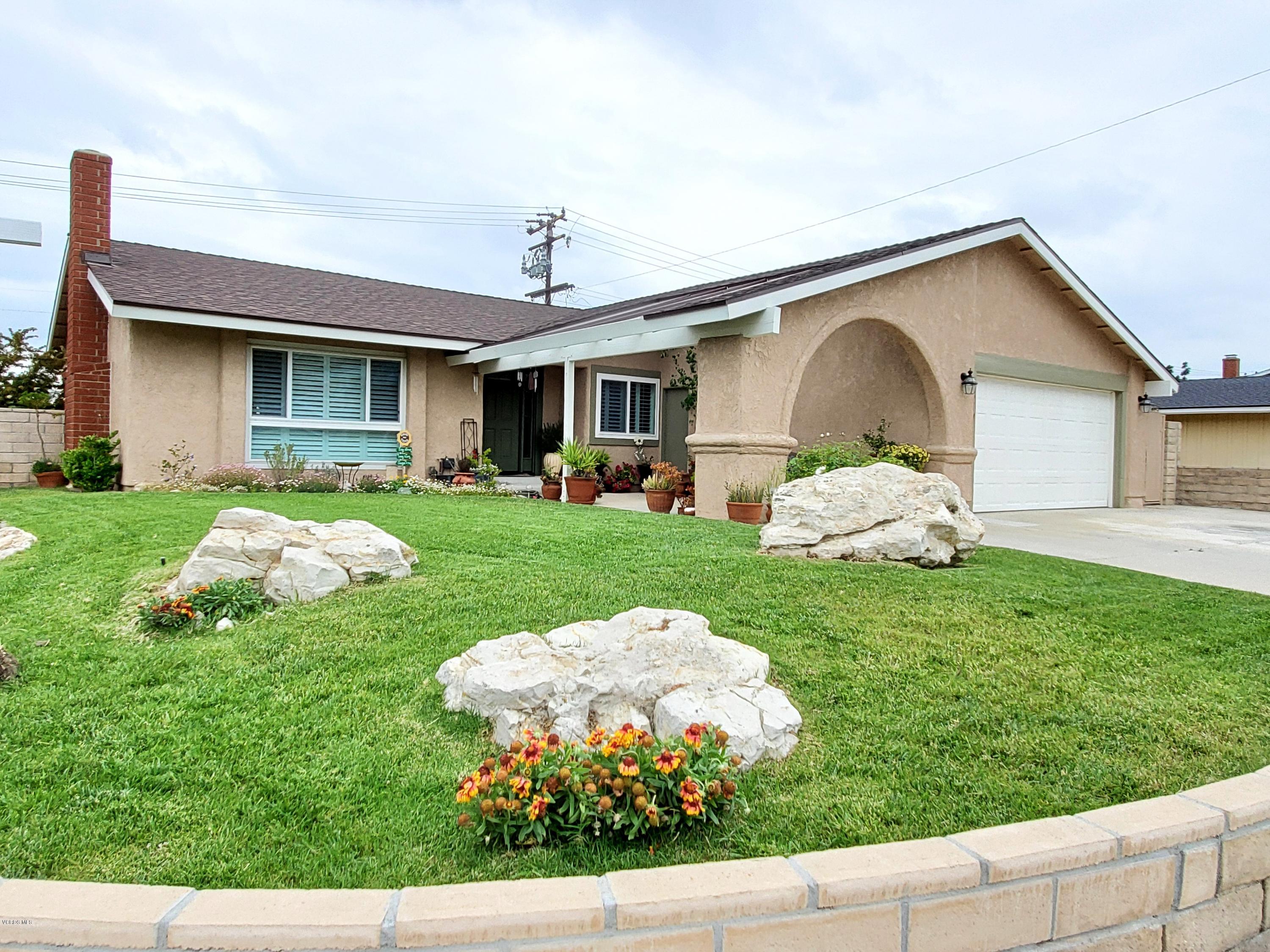 1817 Belhaven Avenue Simi Valley, CA 93063 - Photo 6 of 39 a front view of a house with garden