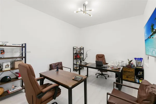a view of a workspace with furniture