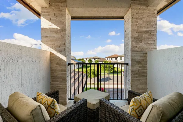 a balcony view with a couch and table