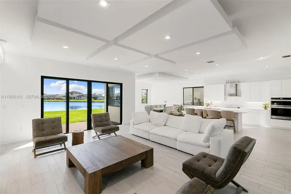 a living room with furniture rug and a table