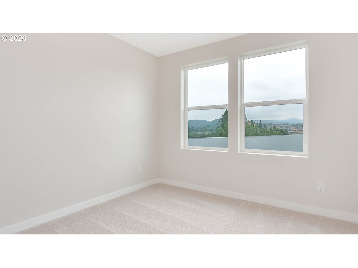 9194 Southeast Azalea Street Happy Valley, OR 97086 - Photo 17 of 32 a open hall with a window