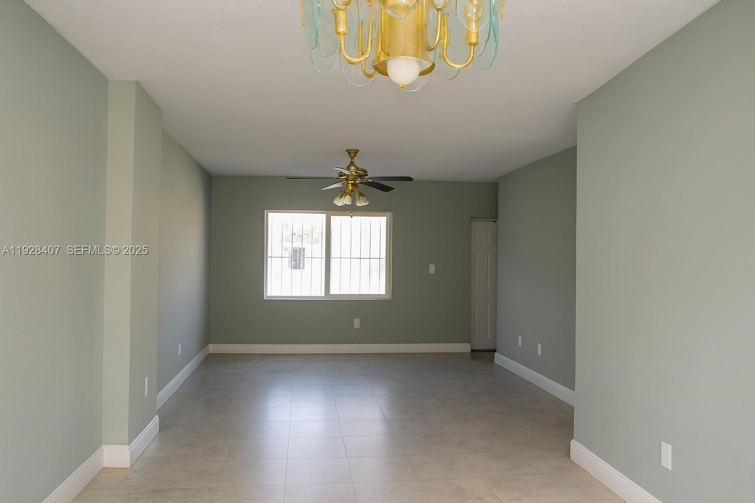 457 Northwest 84th Street, Unit 457 Miami, FL 33150 - Photo 2 of 4 an empty room with a window