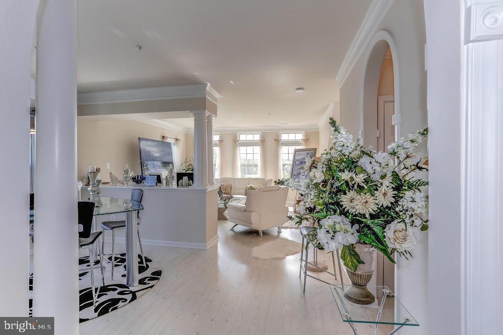a living room with furniture and a large mirror