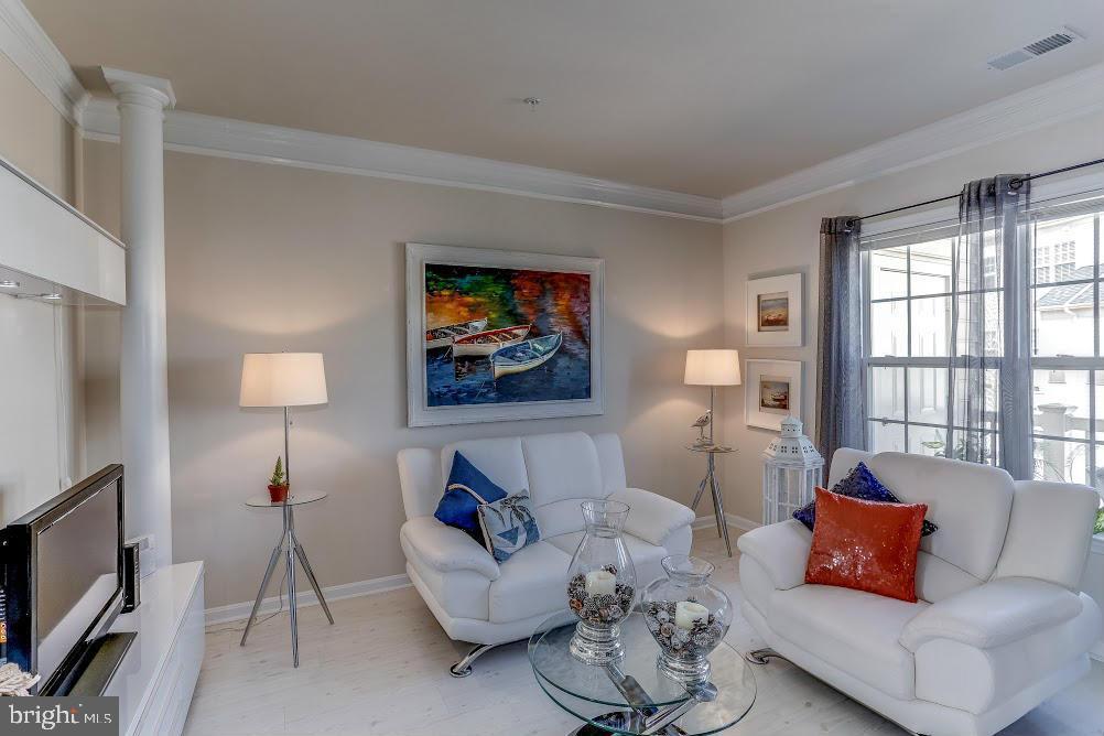 1838 B Monocacy View Circle, Unit 55B Frederick, MD 21701 - Photo 16 of 28 a living room with furniture and a flat screen tv