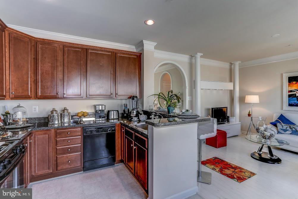 1838 B Monocacy View Circle, Unit 55B Frederick, MD 21701 - Photo 20 of 28 a kitchen with a sink stove and cabinets